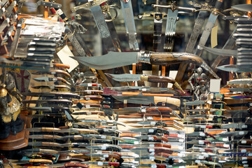 Diversity of handmade forged swords, daggers and knives for sale in gift shop of Toledo. Authentic...