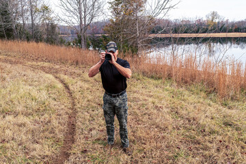 A photographer taking wildlife photos at a lake on Tims Ford in Winchester, Tennessee.
