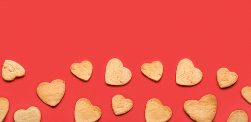 Sweet heart-shaped cookies on red background. Valentine's Day celebration
