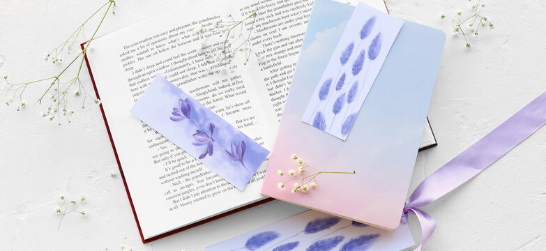 Book, notebook, flowers and beautiful bookmarks on light background