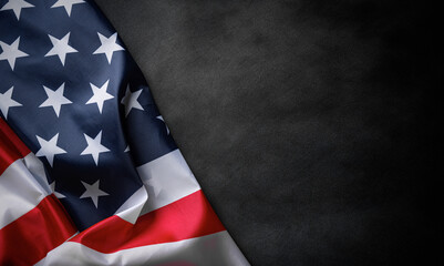 USA American flag on worn darck background. Image suitable for Patriotic concept, USA Memorial day, Labor day, 4th of July or Veteran's day celebration.