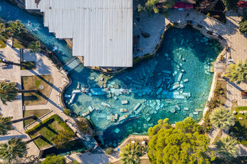 Antique pool Cleopatra Bath in Pamukkale. Turkey travel, aerial top view