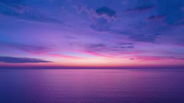 Aerial view hyperlapse of Majestic sunset or sunrise landscape, Amazing light of nature cloudscape sky and Cloud over sea moving away rolling colorful dark sunset cloud Footage timelapse Beautiful sky