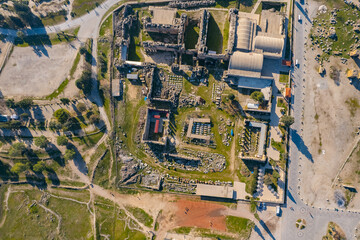 Pamukkale Turkey ancient ruins of city and amphitheater, aerial top view