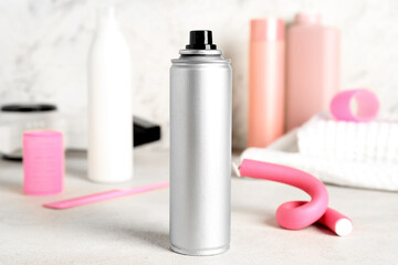 Hair spray on light table, closeup