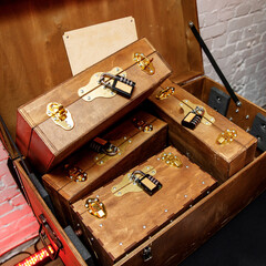 Old wooden boxes closed with a combination lock.