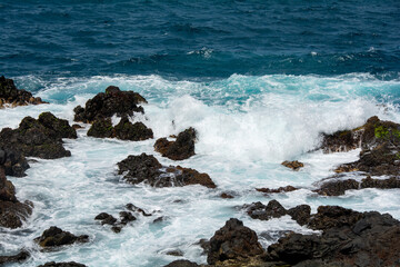 Lava stones in the surf