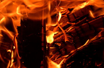 Intensive combustion of firewood under the influence of forced air.