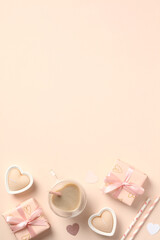 Elegant Valentine's Day vertical background. Flat lay Valentines gift boxes, heart shaped candles, coffee cup on beige background.