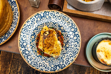 Brandade is an emulsion of salted cod, olive oil, and usually potatoes. It is eaten in winter with bread or potatoes