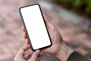 cell phone blank white screen mockup.hand holding texting using mobile on desk at office.background empty space for advertise.work people contact marketing business,technology