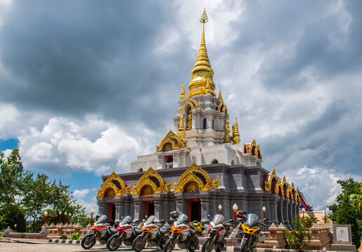 Motorcycles parked near stupa, Nan, Mueang Chiang Rai District, Thailand