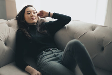 portrait of a beautiful young woman on a sofa