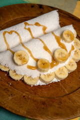 Beiju de Tapioca, Brazilian dish based on cassava starch. With banana and honey