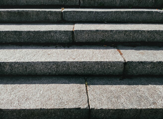 Close-up of old granite steps with wide joints.