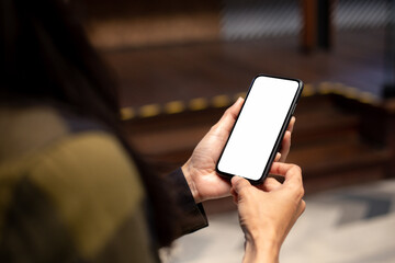 cell phone blank white screen mockup.hand holding texting using mobile on desk at office.background empty space for advertise.work people contact marketing business,technology