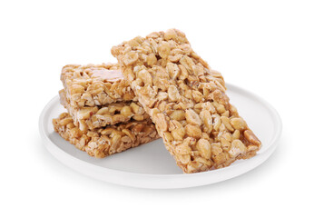 Plate with tasty peanut bars (kozinaki) isolated on white