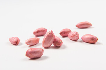 Raw peanuts seeds isolated on white background.