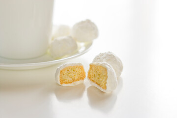 Fototapeta na wymiar Tea cookies on a white background with a tea cup and saucer.