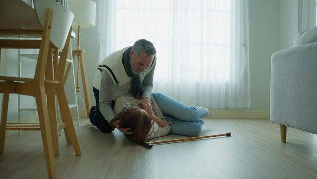 Caucasian senior woman fall on the ground while walk with walker