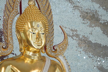 close up of golden Buddha statue is a stunning sight to behold. The intricate details and craftsmanship of the sculpture are clearly visible, showcasing the skill and talent of artist who created it.