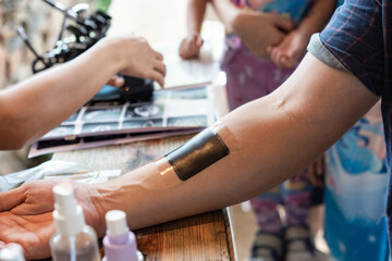 The modern alternative for someone who wants tattoo art on their skin but doesn't want to get wounded by a needle or go through the tattoo process is an air brush tattoo.