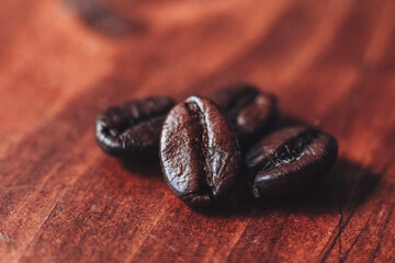 closeup of coffee beans on a wooden background