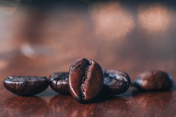 closeup of coffee beans on wooden background