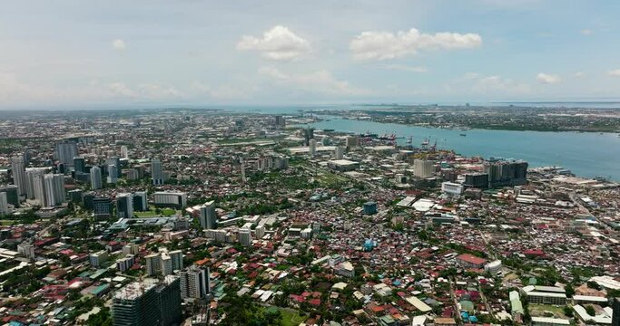 Aerial view of Cebu city with port, modern buildings and business districts. Philippines.