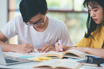 Young students campus helps friend catching up and learning.