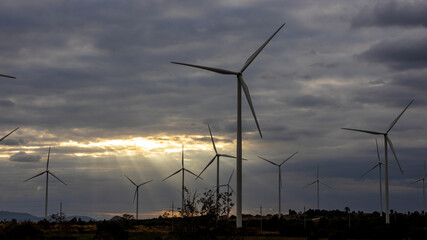 Wind Turbines Windmill Energy Farm. windmill wind turbines in field. Wind turbines power generator electric.