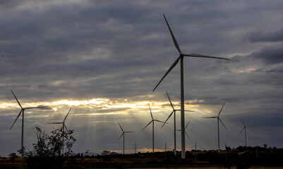 Wind Turbines Windmill Energy Farm. windmill wind turbines in field. Wind turbines power generator electric.