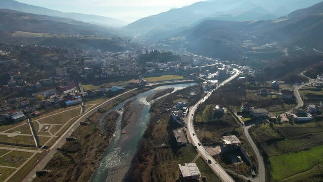Librazhd city built on banks of Shkumbini river at morning, small town in Albania