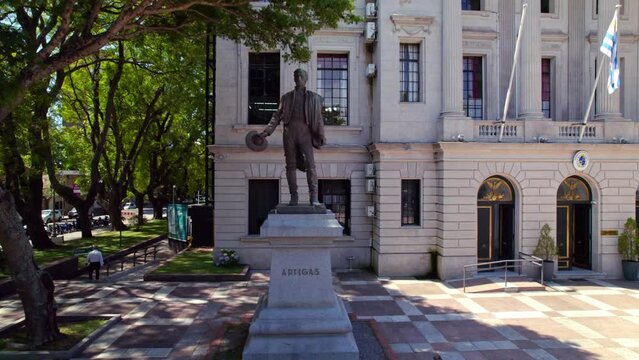 Dolly shot of statue of General Artigas in front of Colonia del Sacramento municipality Building, Uruguay