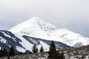 Fototapeta na wymiar View of a Single Snowy Mountain Peak