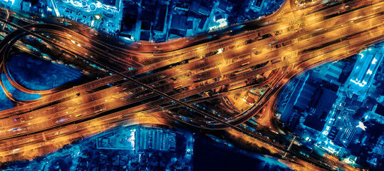 Aerial view of transportation with Expressway, Road and Roundabout, multilevel junction traffic highway-Top view. Important infrastructure and transport in big city, Bangkok Thailand.