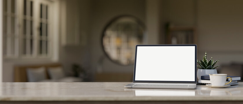 Workspace tabletop with blank screen laptop mockup in modern bedroom