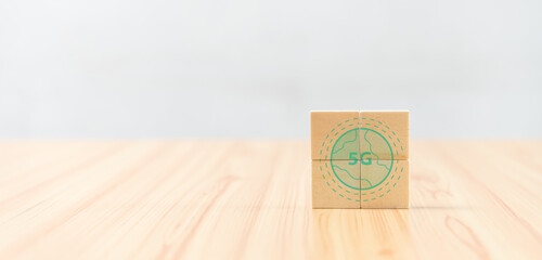 Wooden cube blocks wood and icon symbol to 5G network high speed mobile internet new age network, mixed media, World wide business.