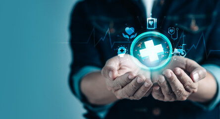 Businessman holding virtual medical health care icons in modern graphic interface