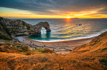 Fototapeta premium Durdle Door at sunset in Dorset, Jurassic Coast of England, UK