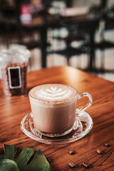 Cup of hot chocolate on wooden table