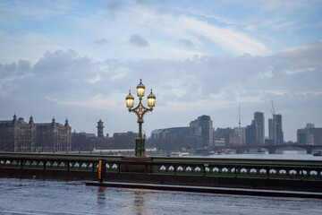 Westminster Bridge over River Thames near Big Ben and Palace of Westminster during evening rainy day in London , United Kingdom : 12 March 2018