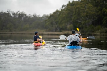 Kayaking on the river at sunset in Australia - obrazy, fototapety, plakaty