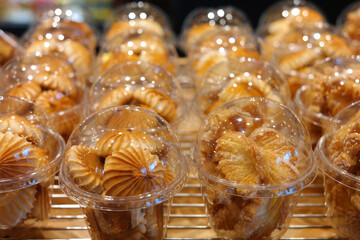 Small cookies individually wrapped in clear plastic cups