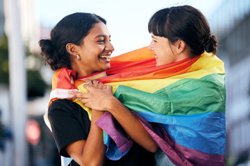 Lgbtq, happy women and flag for pride, equality and protest of love, support and care in city. Gay,...