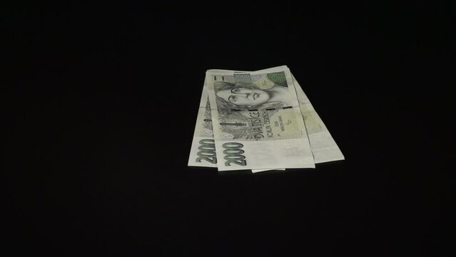 Counting Czech Koruna banknotes in nominal 2000 CZK