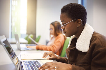 Education, black woman and laptop for studying, knowledge and learning in classroom. African...