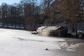 Trakai, Lithuania - 01 08 22: old boat on a frozen lake
