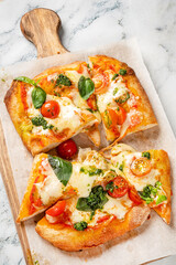 tasty pizza on the wooden board