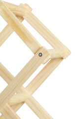 Cropped detailed shot of a foldable light wooden stand for ten bottles of wine. The folded wine bottle stand made out of light wood is isolated on the white background.